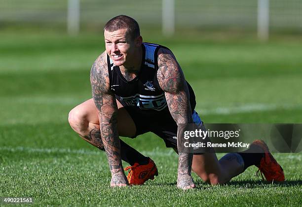 Todd Carney stretches during a Cronulla Sharks NRL training session at Remondis Stadium on May 14, 2014 in Sydney, Australia.