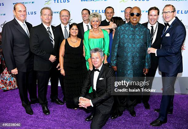 David Foster and Stevie Wonder with members of the David Foster Foundation arrive at the David Foster Foundation Miracle Gala And Concert at Mattamy...