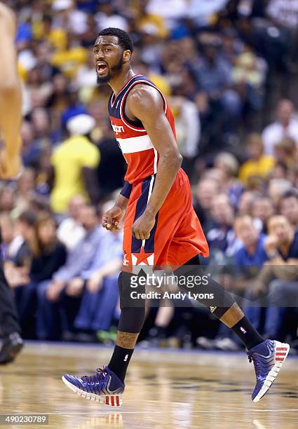 John Wall of the Washington Wizards celebrates in the 102-79 win over the Indiana Pacers in Game 5 of the Eastern Conference Semifinals during the...