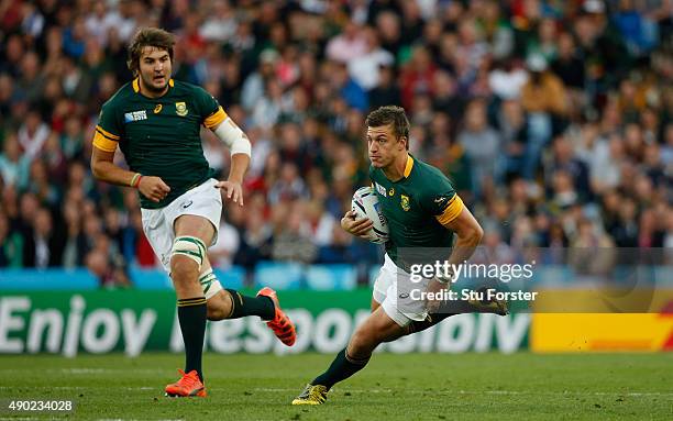 Handre Pollard of South Africa makes a break during the 2015 Rugby World Cup Pool B match between South Africa and Samoa at Villa Park on September...