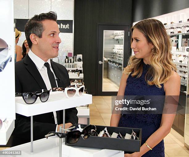 David Hanson from Sunglass Hut with host Renee Bargh as EXTRA shows off the latest Spring/Summer Sunglass trends at Westfield Century City on May 13,...