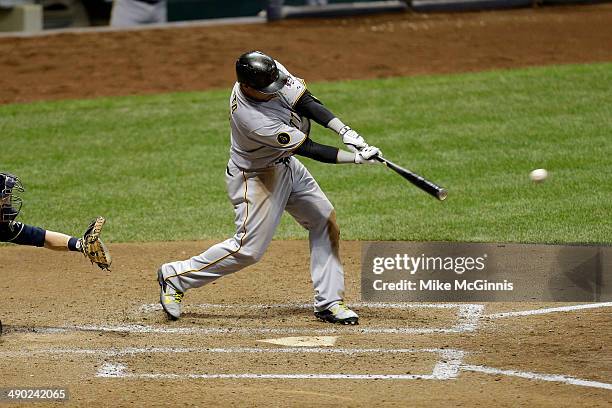 Jose Tabata of the Pittsburgh Pirates hits a singles in the top of the sixth inning against the Milwaukee Brewers at Miller Park on May 13, 2014 in...