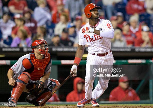 Left fielder Domonic Brown of the Philadelphia Phillies hits a triple in the bottom of the seventh inning against the Los Angeles Angels of Anaheim...