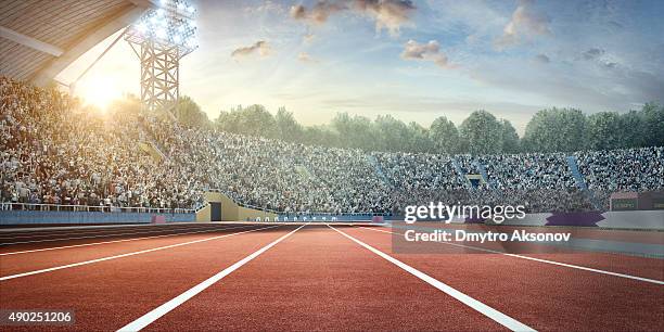 stadium with running tracks - race track stock pictures, royalty-free photos & images