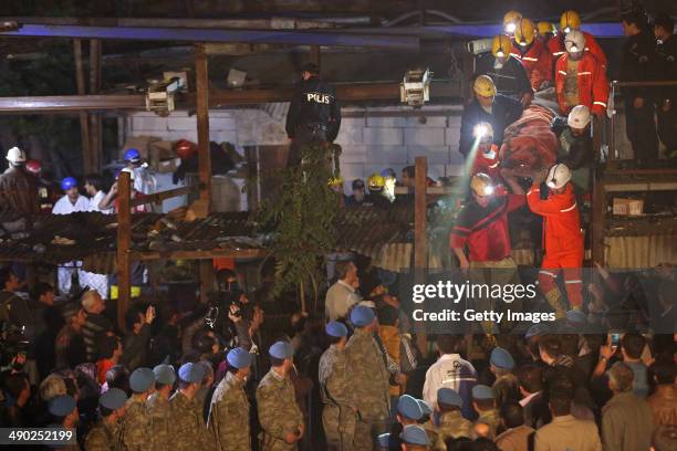 The body of miner is carried to an ambulance on May 14, 2014 in Soma, Turkey. An explosion and fire in the coal mine killed at least 201 miners and...