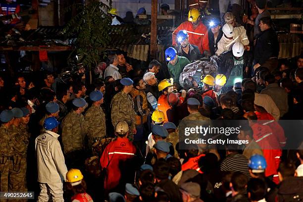 The body of miner is carried to an ambulance on May 14, 2014 in Soma, Turkey. An explosion and fire in the coal mine killed at least 201 miners and...