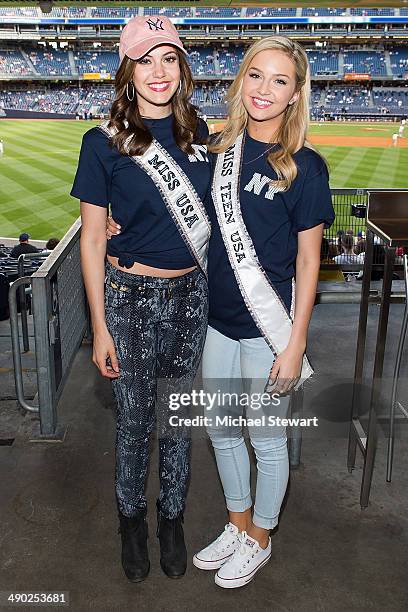 Miss USA 2013 Erin Brady and Miss Teen USA 2013 Cassidy Wolf seen at the New York Mets vs New York Yankees game on May 13, 2014 in New York City.