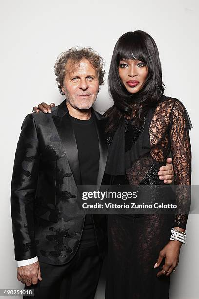 Renzo Rosso and Naomi Campbell pose at amfAR Milano 2015 at La Permanente on September 26, 2015 in Milan, Italy.