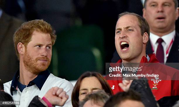Prince Harry and Prince William, Duke of Cambridge attend the England v Wales match during the Rugby World Cup 2015 at Twickenham Stadium on...
