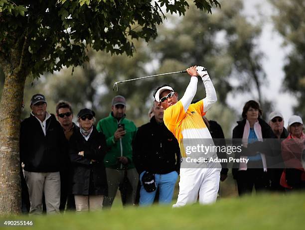 Thongchai Jaidee of Thailand hits out of the rough on hole 3 during the final round of the Porsche European Open at Golf Resort Bad Griesbach on...