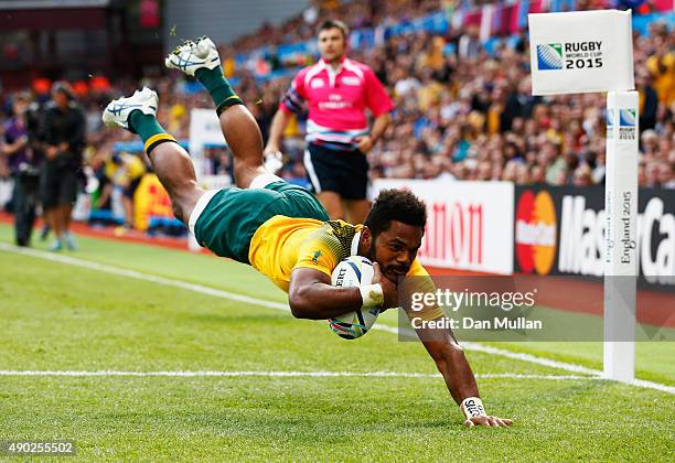 Henry Speight of Australia dives in to score their fourth try during the 2015 Rugby World Cup Pool A match between Australia and Uruguay at Villa...