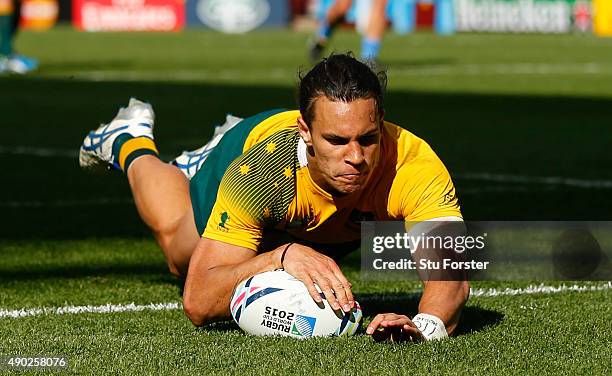 Matt Toomua of Australia dives over to score their tenth try during the 2015 Rugby World Cup Pool A match between Australia and Uruguay at Villa Park...