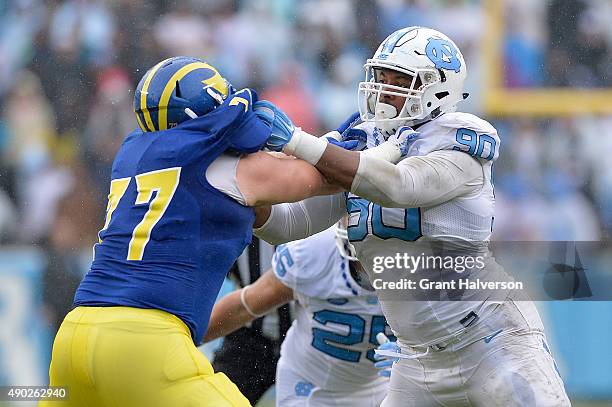 Mario Farinella of the Delaware Fightin Blue Hens blocks Nazair Jones of the North Carolina Tar Heels during their game at Kenan Stadium on September...