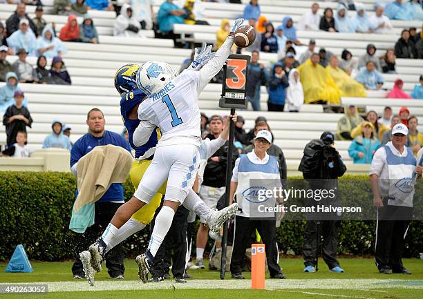 Mike Hughes of the North Carolina Tar Heels knocks away a pass intended for Tre Brown of the Delaware Fightin Blue Hens during their game at Kenan...