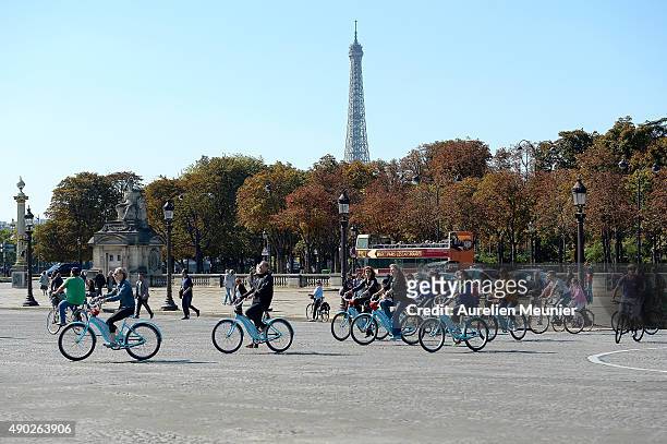 People riding their bikes Place de la Concorde with the Eiffel Tower in the background during the car free day on September 27, 2015 in Paris,...
