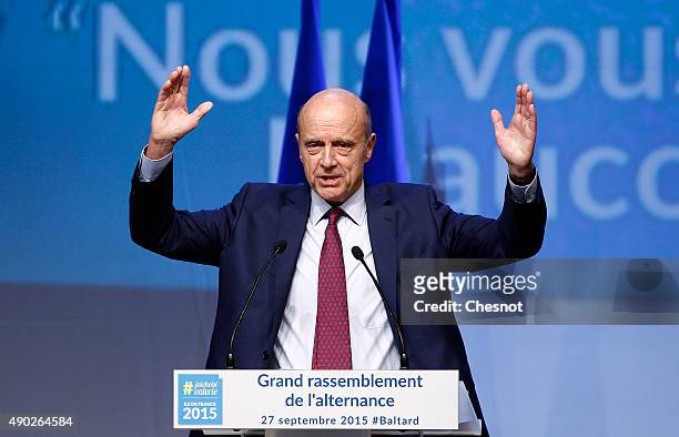 Les Republicains' party member and Mayor of Bordeaux Alain Juppe gestures during a campaign meeting on September 27, 2015 in Nogent-sur-Marne,...