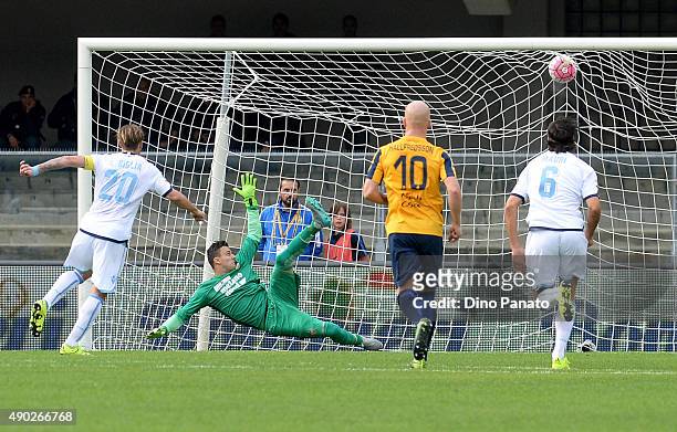 Lucas Biglia of SS Lazio scores his team's first goal from the penalty spot during the Serie A match between Hellas Verona FC and SS Lazio at Stadio...