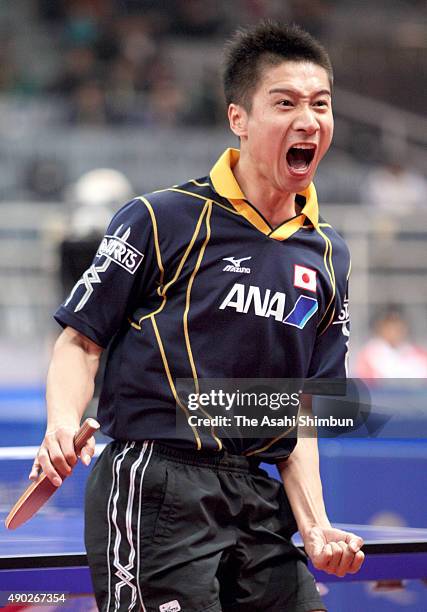 Kaii Yoshida of Japan celebrates a point against Chuang Chih-Yuan of Chinese Taipei in the Men's Team second stage match between Japan and Chinese...