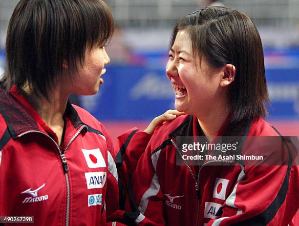 Ai Fukuhara and Sayaka Hirano of Japan celebrate winning against Hungary in the Women's Team Quarter final during the 2008 World Team Table Tennis...