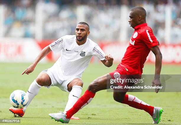 Nilson of Santos and Juan of Internacional in action during the match between Santos and Internacional for the Brazilian Series A 2015 at Vila...