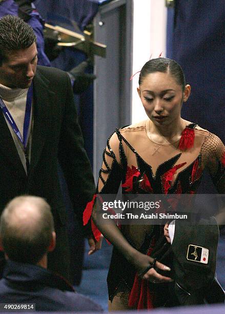 Miki Ando of Japan is seen after withdrawing with her coach Nikolai Morozov during day three of the World Figure Skating Championships at...