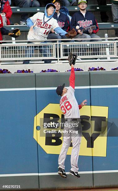 Grady Sizemore of the Boston Red Sox can't catch a home run by Eduardo Nunez of the Minnesota Twins in the second inning and the Twins beat the Red...