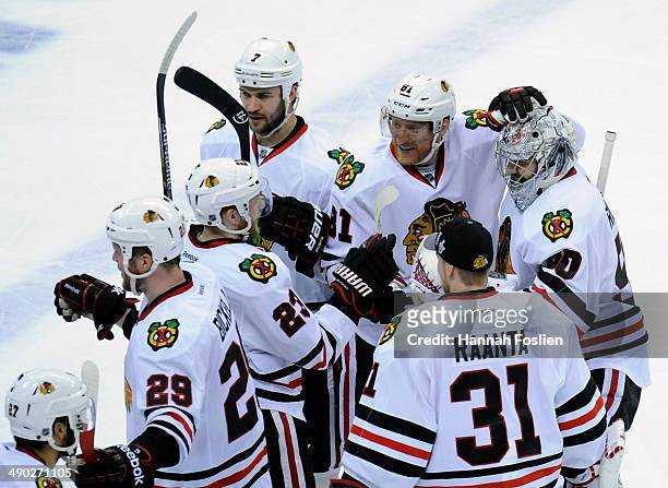 The Chicago Blackhawks celebrate a goal by Patrick Kane against the Minnesota Wild during overtime in Game Six of the Second Round of the 2014 NHL...
