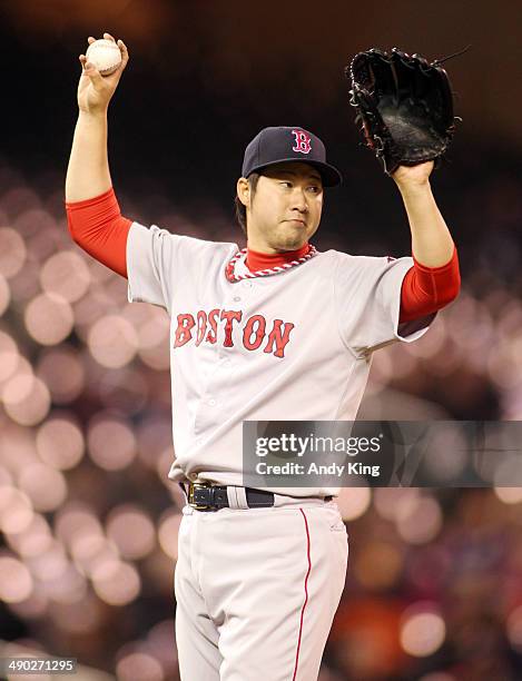 Junichi Tazawa of the Boston Red Sox throws in eighth inning against the Minnesota Twins as the Twins beat the Red Sox 8-6 during MLB game action won...