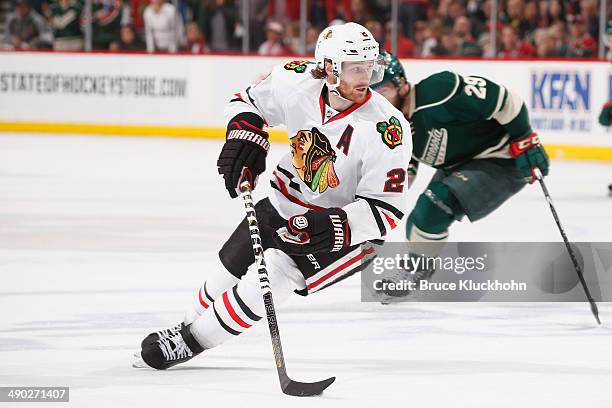 Duncan Keith of the Chicago Blackhawks skates with the puck against the Minnesota Wild during Game Six of the Second Round of the 2014 Stanley Cup...