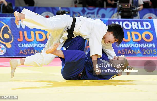 Mami Umeki of Japan and Anamari Velensek of Slovenia compete in the Women's -78kg final during the 2015 Astana World Judo Championships at the Alau...