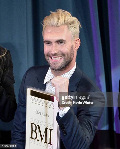 Singer-songwriter Adam Levine of Maroon 5 accepts the 2014 BMI Songwriter of the Year Award onstage at the 62nd annual BMI Pop Awards at the Regent...
