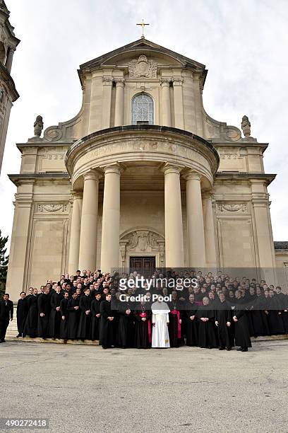 Pope Francis poses with seminarians on the steps of St. Martin of Tours Chapel following his address to the Bishops at Saint Charles Borromeo...