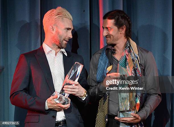 Singer-songwriter Adam Levine of Maroon 5 and producer/songwriter Jeff Bhasker accept the 2014 BMI Songwriter of the Year Award onstage at the 62nd...