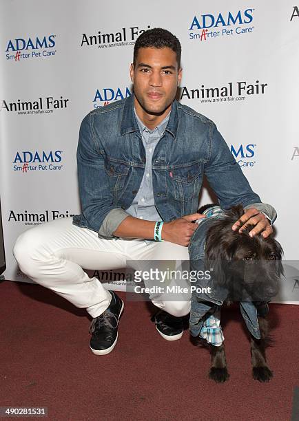 Former NFL football player Devin Goda with dog Max Man attend the 12th Annual Animalfair.com Paws For Style Fashion Show at Pacha on May 13, 2014 in...