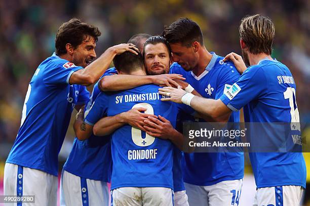 Marcel Heller of Darmstadt celebrates his team's first goal with team mates during the Bundesliga match between Borussia Dortmund and SV Darmstadt 98...