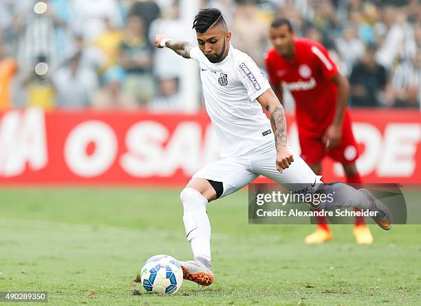 Gabriel of Santos scores their second goal during the match between Santos and Internacional for the Brazilian Series A 2015 at Vila Belmiro stadium...