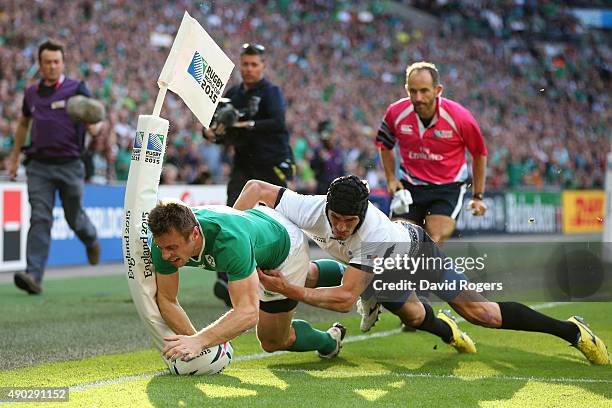 Tommy Bowe of Ireland scores his teams first try during the 2015 Rugby World Cup Pool D match between Ireland and Romania at Wembley Stadium on...