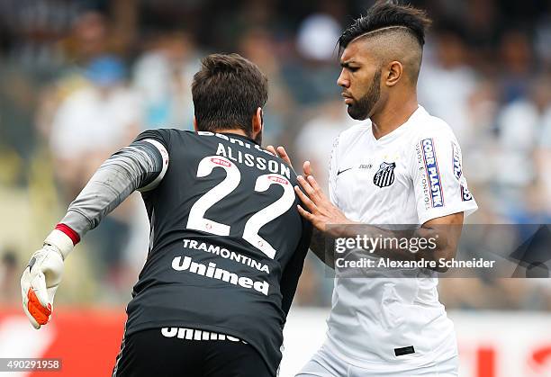 Aisson, goal keeper of Internacional and Gabriel of Santos in action during the match between Santos and Internacional for the Brazilian Series A...