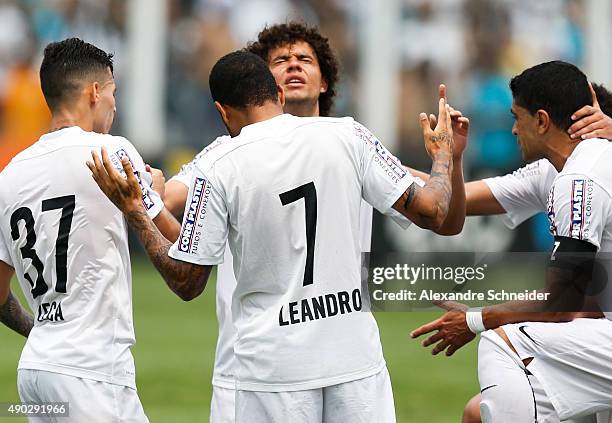 Leandro of Santos celebrates their thirth goal with his teammates during the match between Santos and Internacional for the Brazilian Series A 2015...