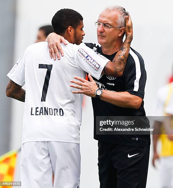 Leandro of Santos celebrates their thirth goal with his teammates during the match between Santos and Internacional for the Brazilian Series A 2015...