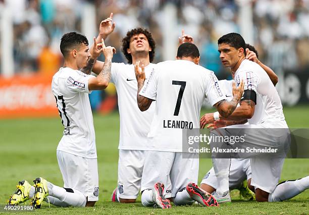 Leandro of Santos celebrates their thirth goal with his teammates during the match between Santos and Internacional for the Brazilian Series A 2015...