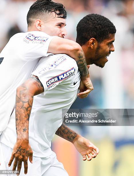 Leandro of Santos celebrates their thirth goal with his teammates during the match between Santos and Internacional for the Brazilian Series A 2015...