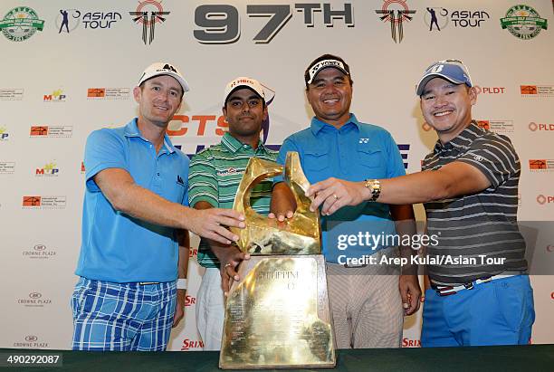 Berry Henson of USA, Anirban Lahiri of India, Mardan Mamat of Singapore and Angelo Que of Philippines pose with the trophy during the press...