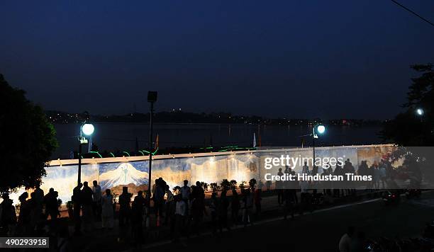 One of the longest paintings on the river Narmada by painter Naresh Kapuria on display during a programme organised to mark the world Tourism Day at...