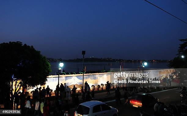 One of the longest paintings on the river Narmada by painter Naresh Kapuria on display during a programme organised to mark the world Tourism Day at...