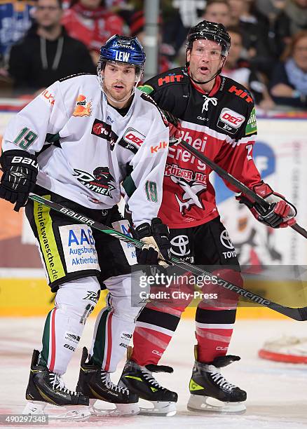 Drew LeBlanc of the Augsburger Panther and Mirko Luedemann of the Koelner Haie during the DEL game between Koelner Haie and the Augsburger Panther on...