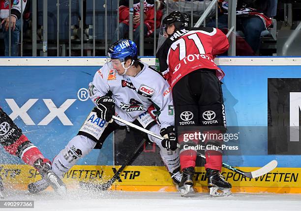 Daniel Weiss of the Augsburger Panther and Andreas Falk of the Koelner Haie during the DEL game between Koelner Haie and the Augsburger Panther on...