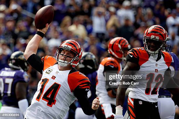 Quarterback Andy Dalton of the Cincinnati Bengals celebrates with wide receiver Mohamed Sanu of the Cincinnati Bengals after scoring a first quarter...