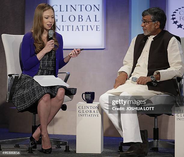 Chelsea Clinton, Vice-chair of the Clinton Foundation, speaks with Kailash Satyarthi during the Clinton Global Initiative annual meeting on September...