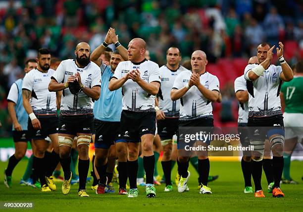 Defeated Romania players applaud the crowd after the 2015 Rugby World Cup Pool D match between Ireland and Romania at Wembley Stadium on September...